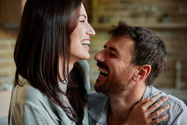 istock Young cheerful couple enjoying together at home. 2155396086