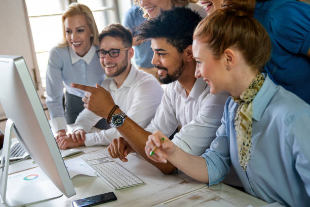 istock Group of business people and software developers working as a team in office 2155396603