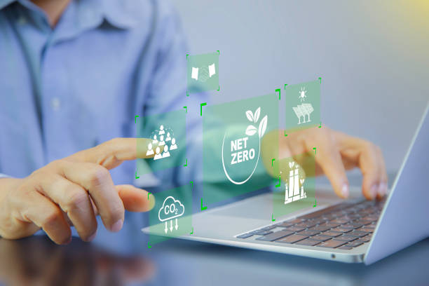 istock Net zero, carbon neutrality concept. Man point at net zero and Green energy icon around it. Green Energy Renewable Sustainable. Net zero emission Idea innovative. carbon neutrality in 2050. 2155397203
