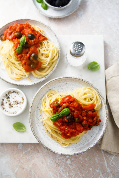 istock Pasta with olives and anchovy 2155397512