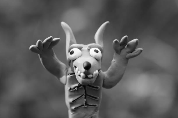 Close-up of child hands playing with clay at school