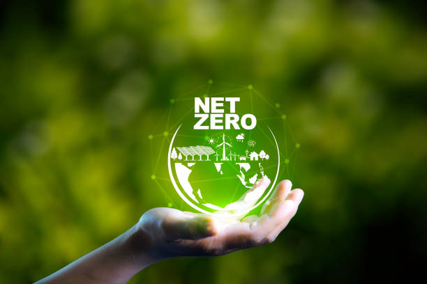 istock Net zero, carbon neutrality concept. Net zero icon at on hand green blur background. Green Energy Renewable Sustainable ( ESG ). Net zero emission Idea innovative. carbon neutrality in 2050. 2155398439