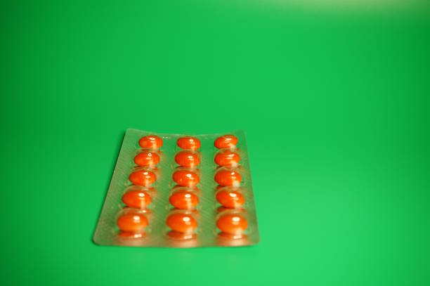 istock A pack of pills on a green background. 2155398930