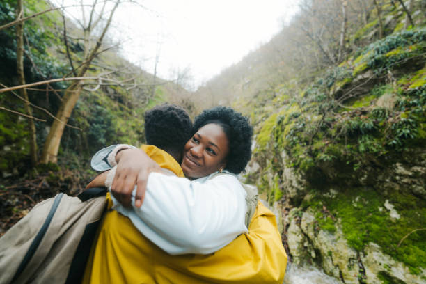 istock Young couple hiking the beautiful nature 2155399653