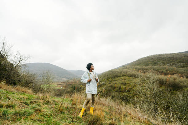 Photo of young African American woman who enjoy hiking and spending time in nature