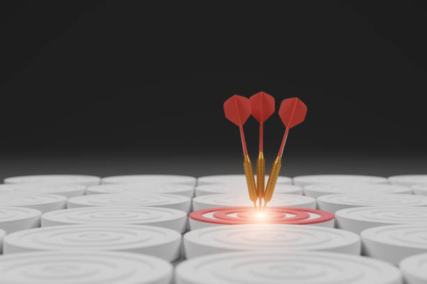 istock Red dart hit on center of target, surrounded by empty white dart board 2155401617