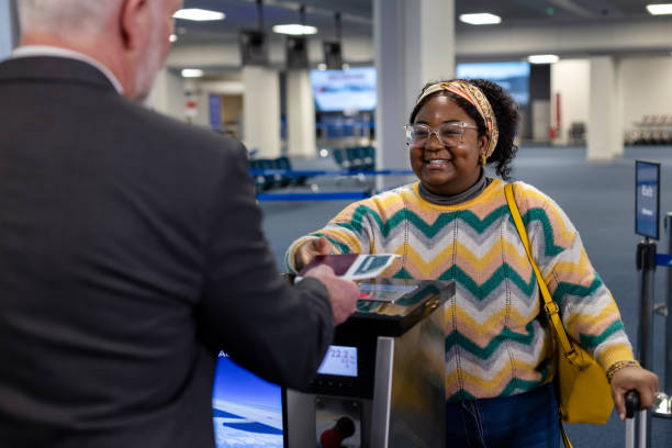 istock Handing Over Passport With A Smile 2155404066