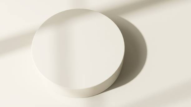 istock Modern and minimal beige geometric round cylinder podium in sunlight, shadow 2155404083