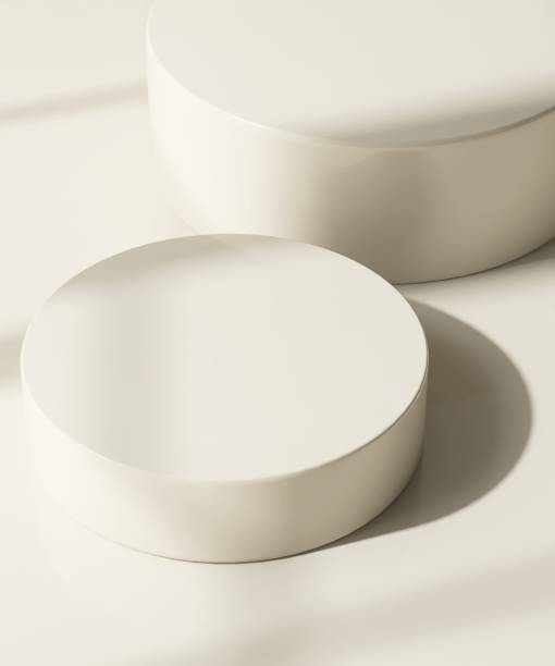 istock Two modern and minimal beige geometric round cylinder podium in sunlight, shadow 2155404087