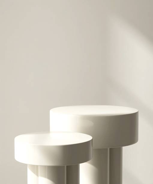 istock Two modern and minimal beige geometric round cylinder podium in sunlight, shadow 2155404119