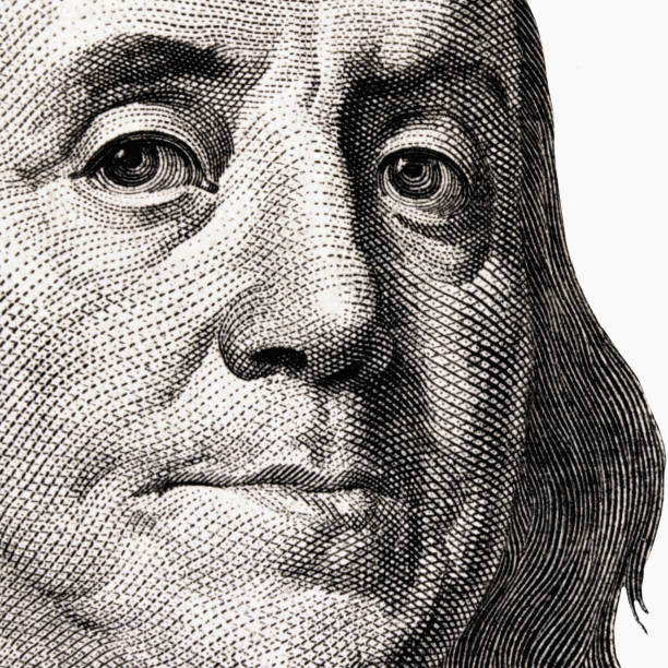 istock Macro image of US Dollar bill. Selective focus on eyes. 2155408531