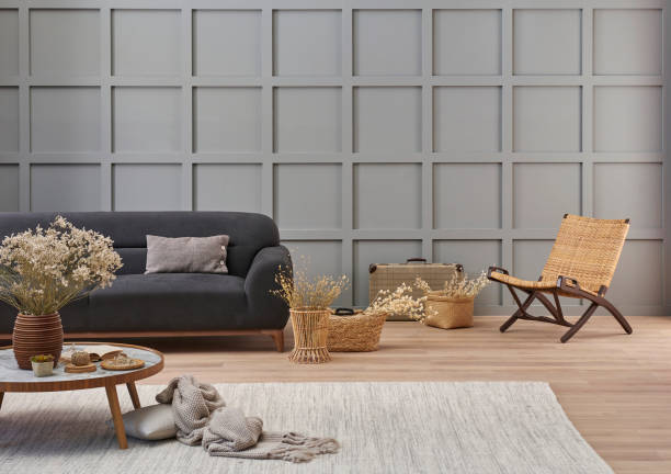 istock Grey room decorative wall background, dark blue sofa, middle table, blanket pillow style, vase of cotton flower and carpet, orange lamp, interior decoration. 2155411377