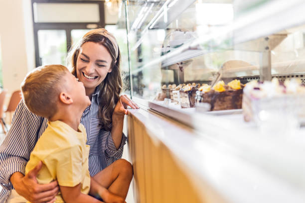istock Mom and Son Choosing Treats 2155414160