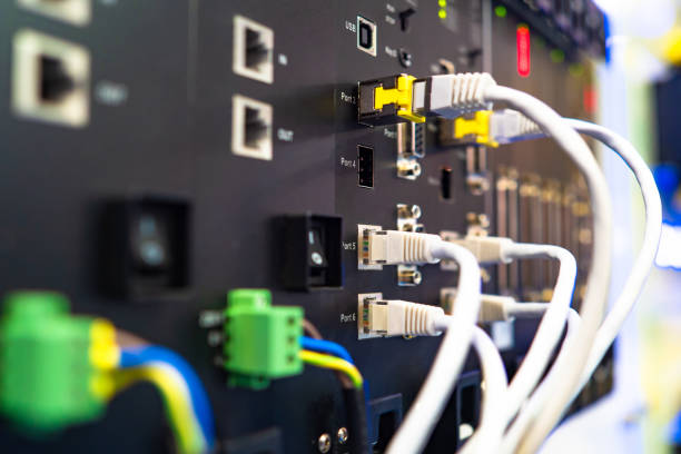 istock Network hardware. Industrial switchboard. Server close up. Concept - maintenance of computer networks. Network technologies. Cables are connected to the equipment. Managed Switch. Enterprise Network 2155415892