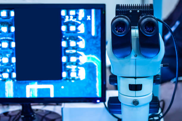 istock Microscope. Check computer boards. The microscope displays the image on the monitor. Electronic circuit boards. Development of new technologies. 2155416316