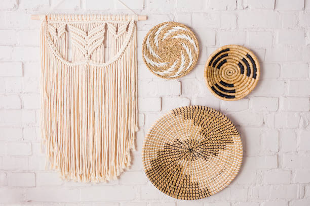 istock Closeup of three decorative straw plates and a macrame 2155416494