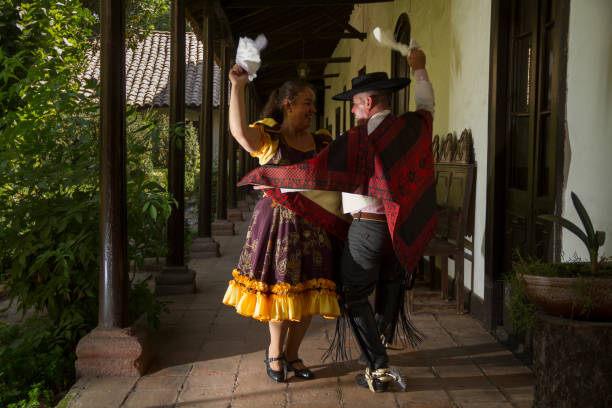 Santiago de Chile, Chile - September 7, 2014: Portrait of latin america / chilean Guazo man and Guaza woman dancing and doing a demonstration of Chilean Traditional Dance named Cueca in rural hacienda near to the Chilean Capital Santiago de Chile.