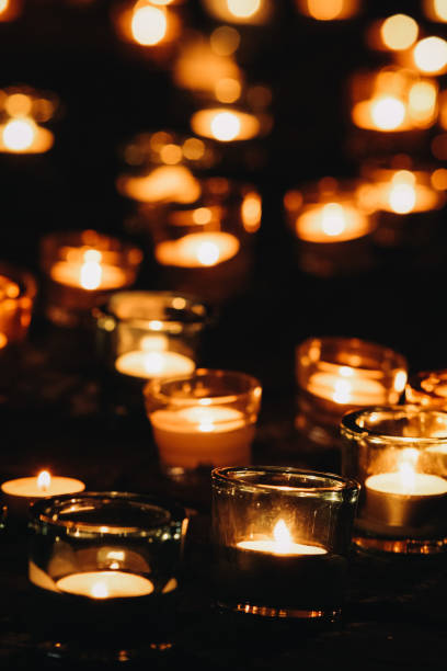 istock Lots of candles on a dark background 2155420005