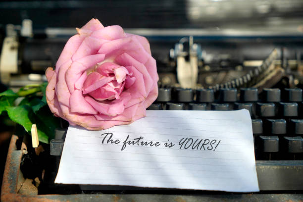 yellow rose on white paper in a cage, fountain pen and postage stamp
