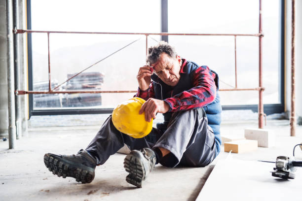 istock Injured worker with wound on head, head injury. Work injury, accident in workplace. 2155422010