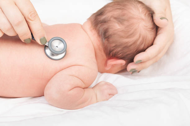 istock Doctor Examining Newborn with Stethoscope 2155422460