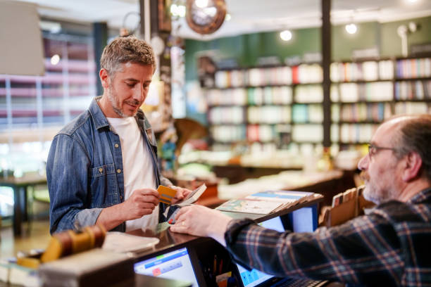 Contactless payment at the bookstore with credit card.