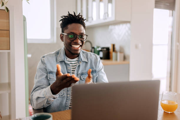 istock Young businessman having video call while working from home office 2155422511