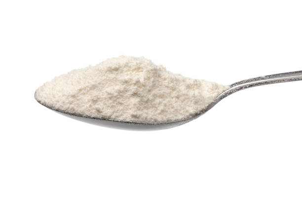 istock Metal spoon with wheat flour on white background 2155423701