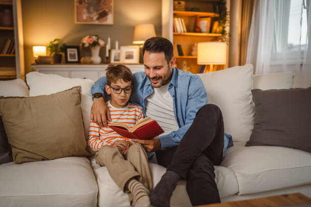 istock Father and son read a book and have fun while spend time together 2155426928
