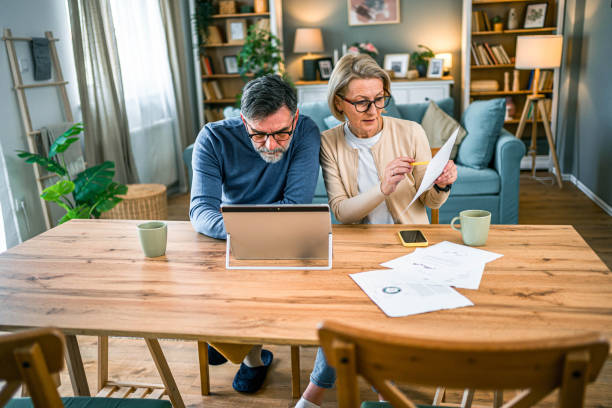 istock Mature couple manages home finances 2155428344