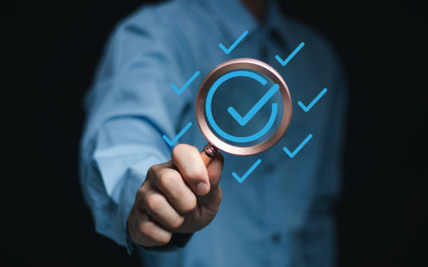 istock Service guarantee, Validation concept for business process automation, quality assurance management, certification, digital transformation. Businessman show checked icon on hand. Quality control. 2155428560