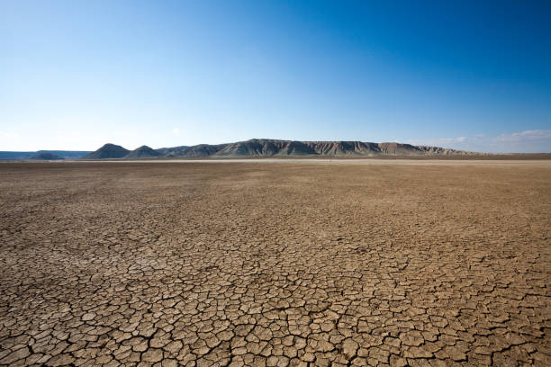 Aerial view dry and cracked earth in the reservoir at Sau reservoir, Catalonia