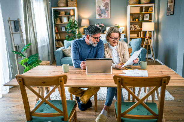 istock Mature couple manages home finances 2155428731