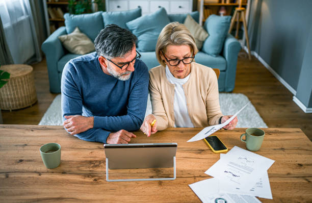 istock Mature couple manages home finances 2155428879