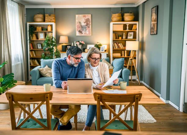 istock Mature couple managing home budget 2155428953