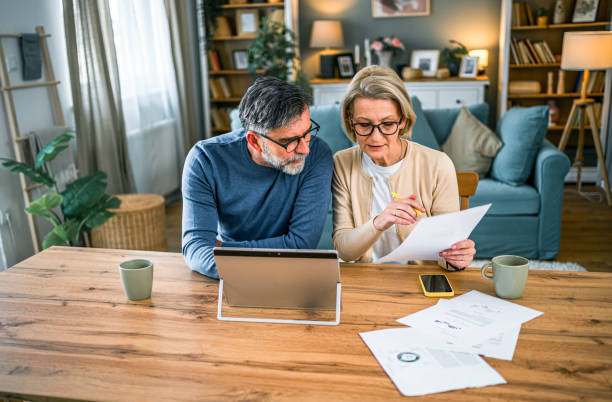 istock Mature couple manages home finances 2155429109