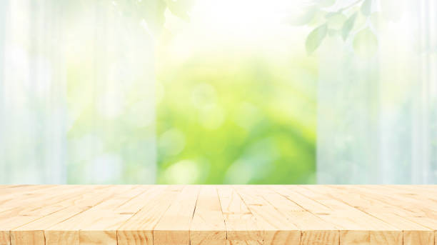 istock Selective focus.Wood table counter on blur curtain window in morning background. 2155432283