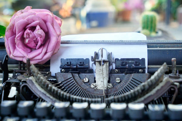 istock Close up of a typewriter with a rose. 2155434105