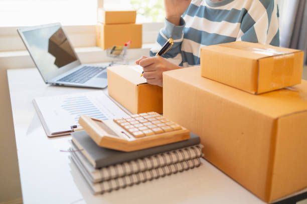 istock SME entrepreneurs prepare packages and verify customer information deliver products according orders. Concepts of selling online and doing online marketing with reliable system of shopping online 2155437442