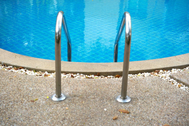 swimming pool stair into blue swimming pool