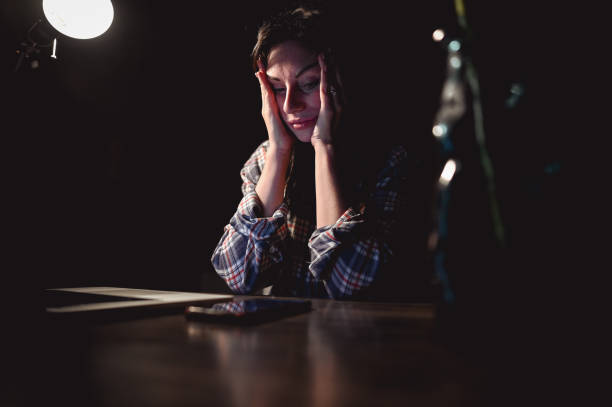 istock Overworked person with headache in office. 2155437915