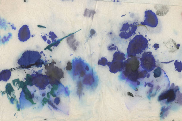 Authentic black and blue ink stains on white kitchen paper