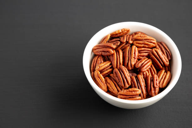 Pecans in wooden box macrophotography
