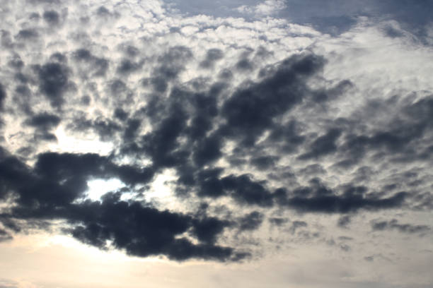 istock Dark and light blue clouds mixed together as the sun is going down 2155462473