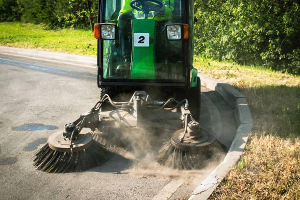 istock Street Sweeper With Rotating Brushes Cleaning Asphalt Pavement 2155464299