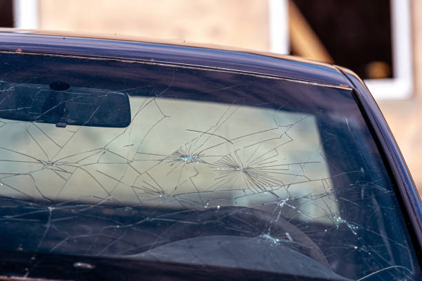 istock Broken windshield on a car. Damaged glass on a car. 2155470392