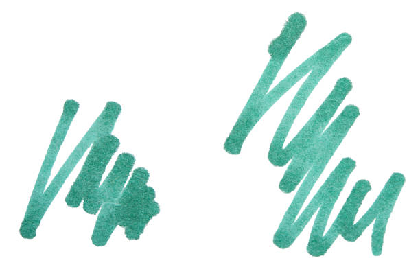 Green highlighter with the cap off on blue background