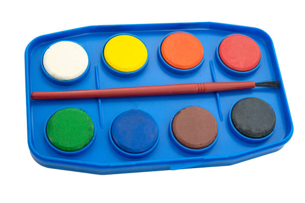Watercolor pallet with brush isolated on white background.