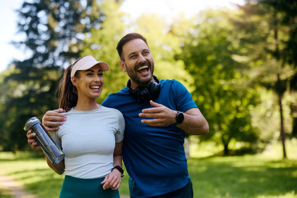 istock Cheerful athletic couple having fun in the park. 2155476200