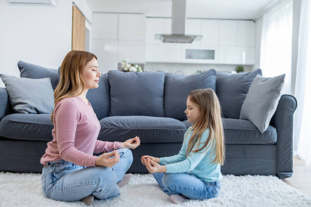 istock Meditation session with mother and daughter 2155478405